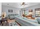 Open concept living area with light teal sofas and wood floors at 12333 Willmington Blvd, Port Charlotte, FL 33981