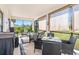 Spacious screened-in porch with seating area and outdoor dining table at 12333 Willmington Blvd, Port Charlotte, FL 33981