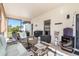 Screened porch with patio furniture and grill, perfect for outdoor dining at 12333 Willmington Blvd, Port Charlotte, FL 33981