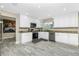 Modern kitchen with white cabinets, granite countertops and stainless steel appliances at 161 Carlisle Nw Ave, Port Charlotte, FL 33952