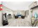 Open living room area with wood-look tile, modern decor, and an inviting layout at 161 Carlisle Nw Ave, Port Charlotte, FL 33952