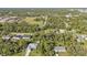 Aerial perspective of a house with a backyard and neighborhood context at 17396 Cox Ave, Port Charlotte, FL 33948