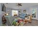 Relaxing living room with comfortable seating and large TV at 17396 Cox Ave, Port Charlotte, FL 33948