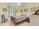 Bedroom with wooden bed frame and window at 17458 Fuego Ln, Punta Gorda, FL 33955