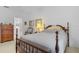 Bedroom with wooden bed frame and dresser at 17458 Fuego Ln, Punta Gorda, FL 33955