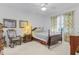 Cozy bedroom with wooden bed frame and rocking chair at 17458 Fuego Ln, Punta Gorda, FL 33955
