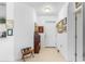 Bright entryway with tile floors and framed artwork at 17458 Fuego Ln, Punta Gorda, FL 33955