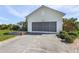 Attached garage with a screened enclosure at 17458 Fuego Ln, Punta Gorda, FL 33955