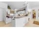Kitchen with white cabinets, a breakfast bar, and tile flooring at 17458 Fuego Ln, Punta Gorda, FL 33955
