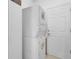Stackable washer and dryer in a dedicated laundry room at 17458 Fuego Ln, Punta Gorda, FL 33955
