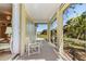 Relaxing screened porch overlooking backyard with table and chairs at 17458 Fuego Ln, Punta Gorda, FL 33955