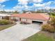 Single-Gathering home with attached garage and large yard at 1923 Pennsylvania Ave, Englewood, FL 34224