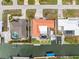 An overhead shot of a waterfront home featuring a pool, patio, and access to a private boat dock and canal at 1923 Pennsylvania Ave, Englewood, FL 34224