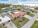 Aerial elevation of a waterfront home featuring a private dock and boat lift with easy access to the canal at 1923 Pennsylvania Ave, Englewood, FL 34224