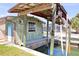 Cozy waterfront dock house with boat lift and canal access, featuring a covered platform at 1923 Pennsylvania Ave, Englewood, FL 34224
