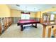 Spacious game room featuring a pool table, tiled floor, and natural lighting at 1923 Pennsylvania Ave, Englewood, FL 34224