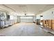 Large garage featuring an automatic door and storage with an entryway to the interior at 1923 Pennsylvania Ave, Englewood, FL 34224