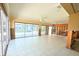Expansive living room with large sliding glass doors and tiled floors, perfect for entertaining at 1923 Pennsylvania Ave, Englewood, FL 34224