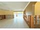 Bright living room with tile floors, fan, and view of pool through sliding doors, needs work at 1923 Pennsylvania Ave, Englewood, FL 34224