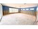 Spacious living room with concrete floor, natural light, and ample room for customization at 1923 Pennsylvania Ave, Englewood, FL 34224