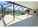 Enclosed backyard pool with a screened lanai, overlooking waterfront at 1923 Pennsylvania Ave, Englewood, FL 34224