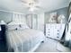Guest bedroom featuring neutral walls, carpet, and a queen bed with stylish decor at 207 Blackburn Blvd, North Port, FL 34287