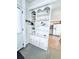 Entryway with built-in shelving, seamlessly connecting to the kitchen and living spaces at 207 Blackburn Blvd, North Port, FL 34287