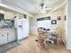 Eat-in kitchen with a white table, chairs, and white appliances against a neutral wall at 207 Blackburn Blvd, North Port, FL 34287