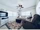 Bright and airy living room, complete with neutral decor and ceiling fan at 207 Blackburn Blvd, North Port, FL 34287