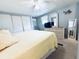The main bedroom offers a light-filled space with closet and white dresser at 207 Blackburn Blvd, North Port, FL 34287