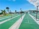 Active shuffleboard courts with clearly marked lanes and a communal gathering area, perfect for leisure and recreation at 207 Blackburn Blvd, North Port, FL 34287