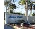 Community entrance sign reading 'Harbor Cove', with landscaped surroundings at 207 Blackburn Blvd, North Port, FL 34287