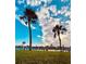 Beautiful waterfront scenery with palm trees and docks under a bright sky at 207 Blackburn Blvd, North Port, FL 34287
