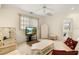 Bright sitting room with comfy seating and built-in shelving at 3800 Bal Harbor Blvd # 312, Punta Gorda, FL 33950