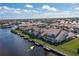Aerial view of a canal front home with private dock and lush landscaping at 3800 Bal Harbor Blvd # 312, Punta Gorda, FL 33950