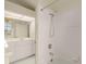 White tiled bathroom with shower and tub at 3800 Bal Harbor Blvd # 312, Punta Gorda, FL 33950