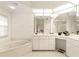 Bathroom features a large vanity, a corner soaking tub and a walk-in shower at 3800 Bal Harbor Blvd # 312, Punta Gorda, FL 33950