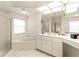 Large bathroom with double vanity, soaking tub and walk-in shower at 3800 Bal Harbor Blvd # 312, Punta Gorda, FL 33950