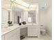 Spacious bathroom with double sinks, toilet, and a large mirror at 3800 Bal Harbor Blvd # 312, Punta Gorda, FL 33950