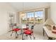 Charming breakfast nook with water views and red cushioned chairs at 3800 Bal Harbor Blvd # 312, Punta Gorda, FL 33950