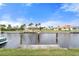 Private dock with view of peaceful canal and neighboring houses at 3800 Bal Harbor Blvd # 312, Punta Gorda, FL 33950