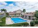 Inviting community pool with surrounding lounge chairs at 3800 Bal Harbor Blvd # 312, Punta Gorda, FL 33950