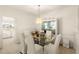 Bright dining room with a view into the kitchen at 3800 Bal Harbor Blvd # 312, Punta Gorda, FL 33950