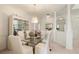 Formal dining room featuring a glass-top table and crystal chandelier at 3800 Bal Harbor Blvd # 312, Punta Gorda, FL 33950