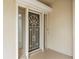 Front door with security screen and storm shutters at 3800 Bal Harbor Blvd # 312, Punta Gorda, FL 33950