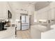 Modern kitchen with stainless steel appliances and white cabinetry at 3800 Bal Harbor Blvd # 312, Punta Gorda, FL 33950