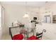 Kitchen boasts white cabinets, breakfast nook, and a view to the backyard at 3800 Bal Harbor Blvd # 312, Punta Gorda, FL 33950
