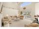 Bright living room with high ceilings, couches and access to a lanai at 3800 Bal Harbor Blvd # 312, Punta Gorda, FL 33950