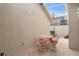 Private patio with wicker furniture and a skylight at 3800 Bal Harbor Blvd # 312, Punta Gorda, FL 33950