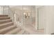 Grand staircase with a white railing leading to the upper level at 3800 Bal Harbor Blvd # 312, Punta Gorda, FL 33950